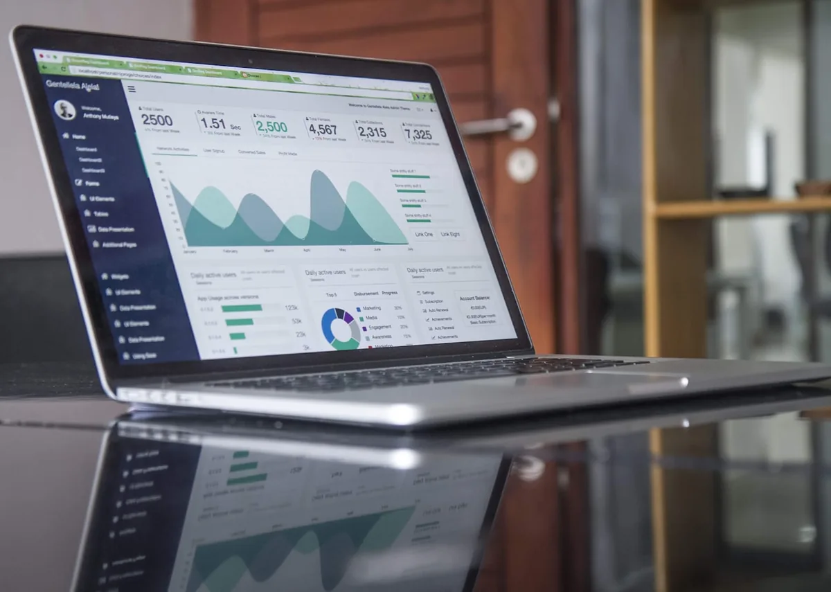 Business operations dashboard on a laptop — job activity, totals and account summaries in one back-office system